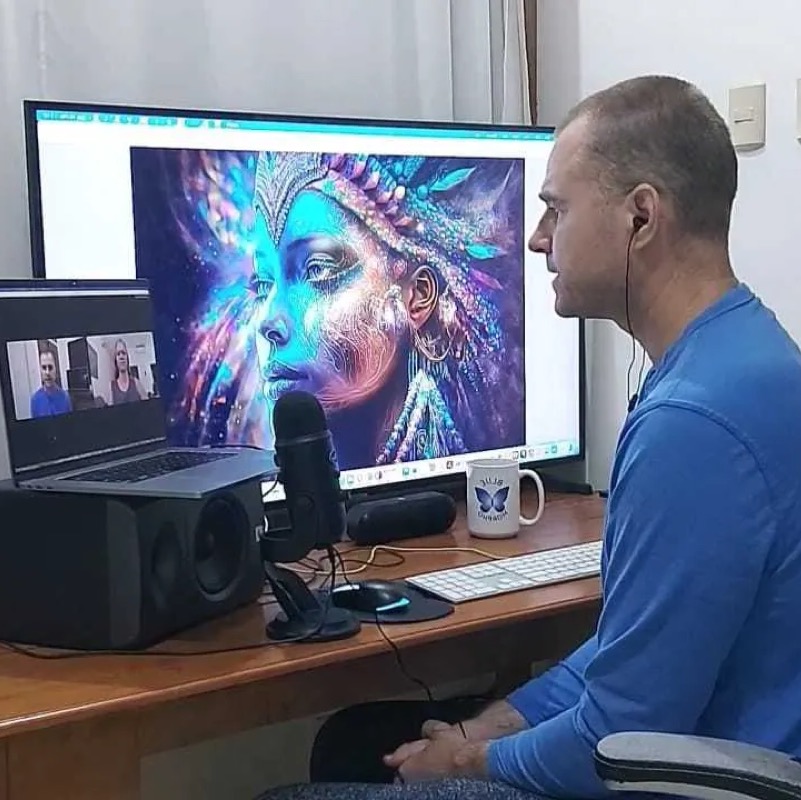 Blue Morpho Podcast image showing Hamilton in front of large computer screen with Shamanic Visionary Art